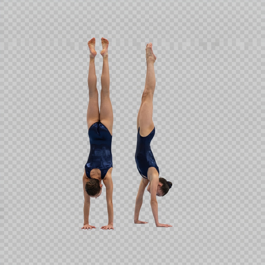Two gymnasts performing a synchronized handstand, side by si