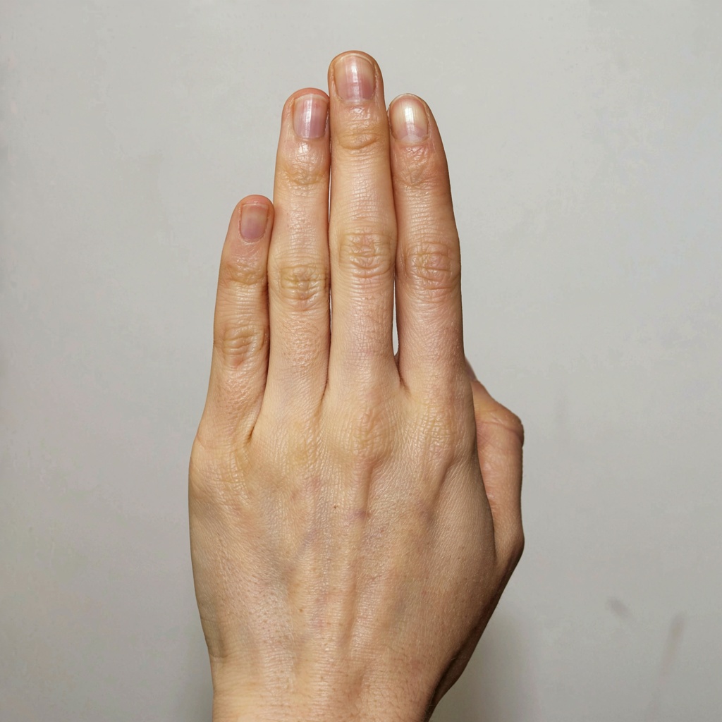 A person counting to three on their fingers, with index, mid