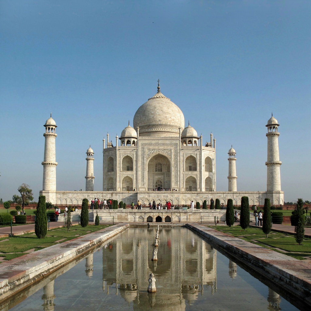 The Taj Mahal in Agra seen from the reflecting pool, with ac