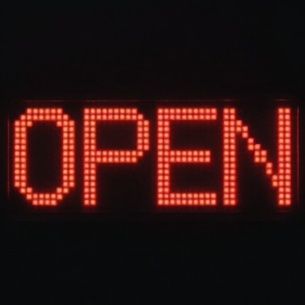 The word 'OPEN' displayed on a red LED sign with glowing pix
