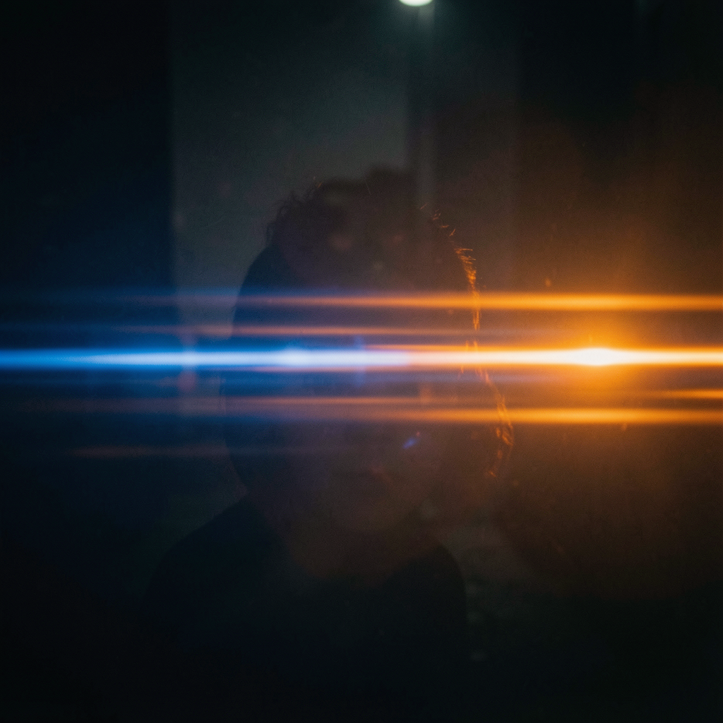 A cinematic frame with blue and orange anamorphic lens flare