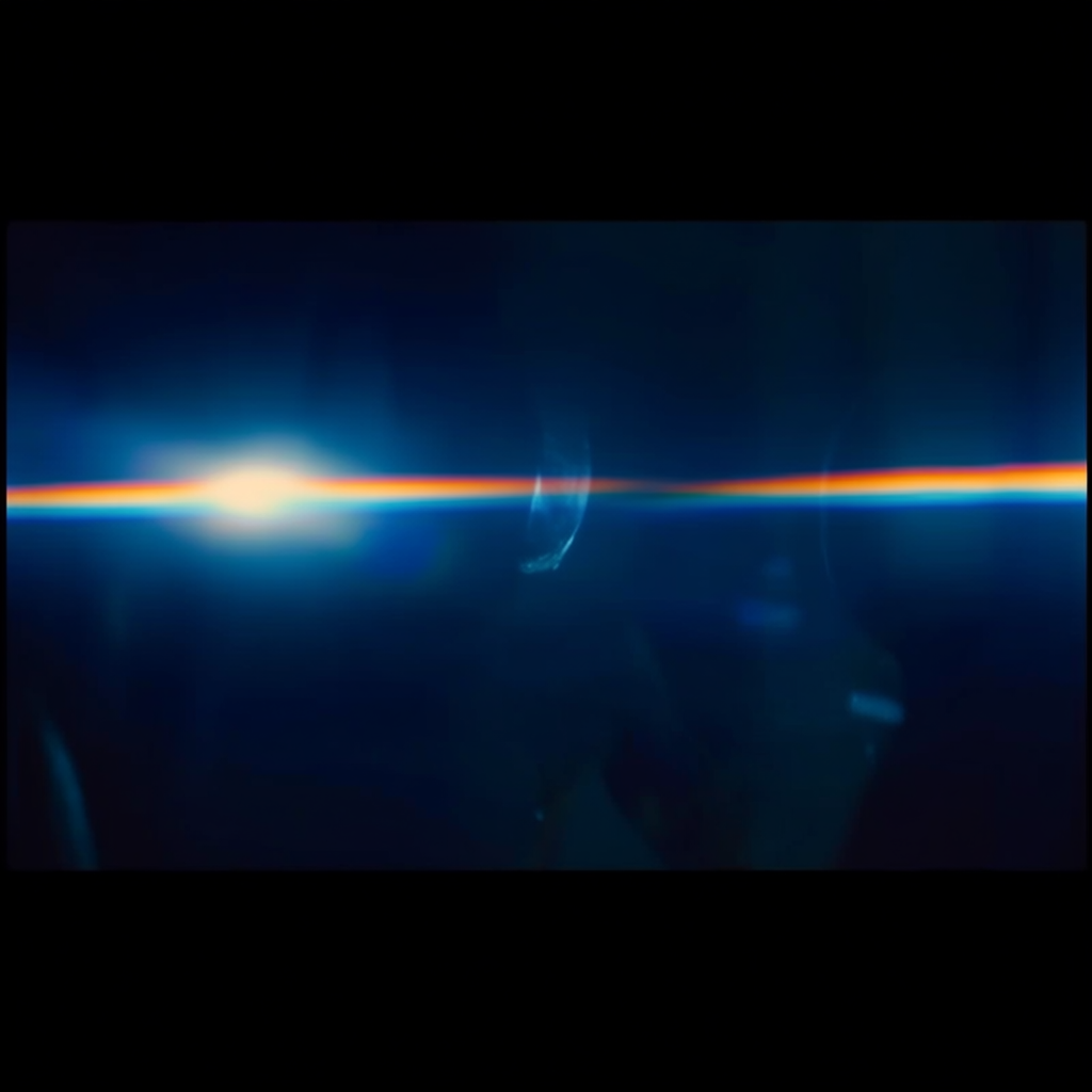 A cinematic frame with blue and orange anamorphic lens flare