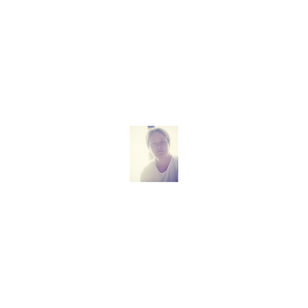 A high-key portrait of a person against a bright white backg