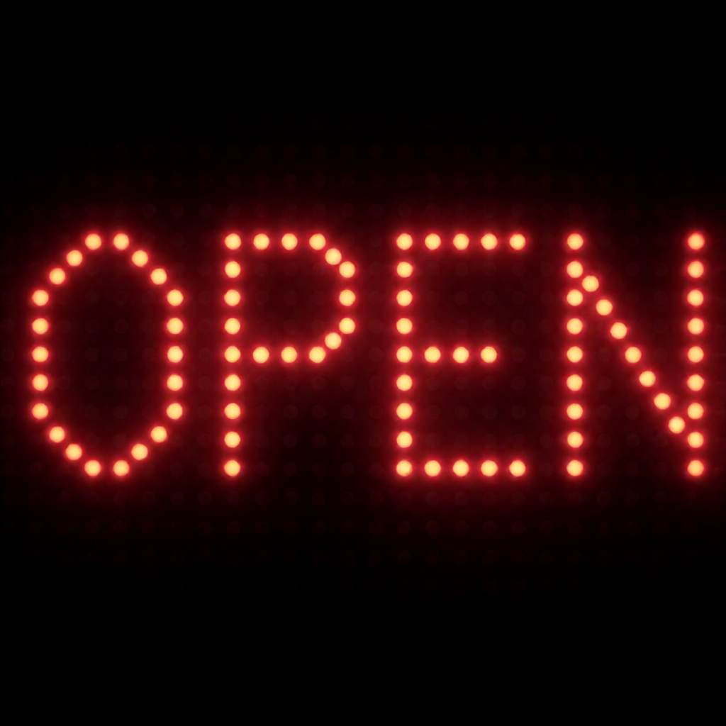 The word 'OPEN' displayed on a red LED sign with glowing pix
