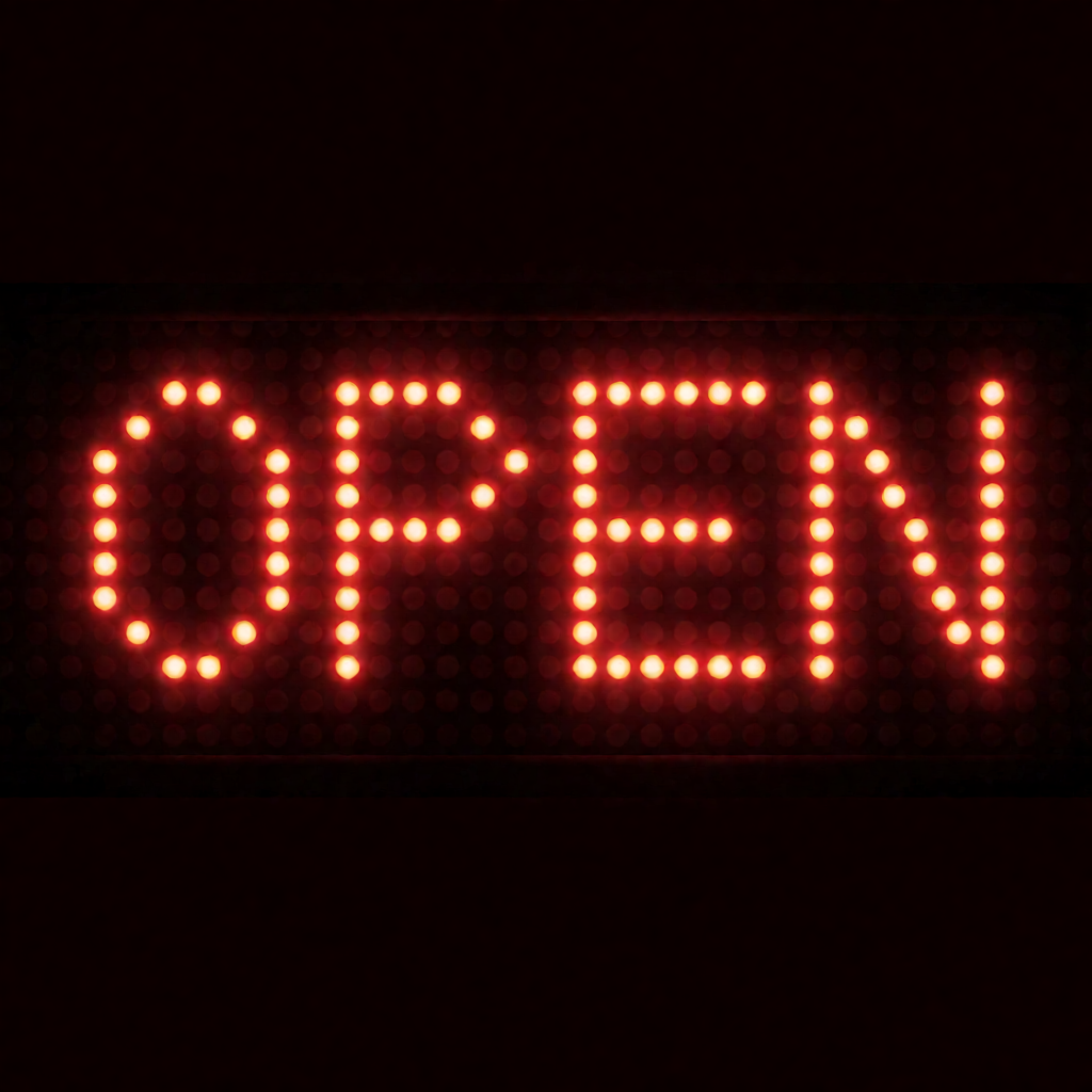 The word 'OPEN' displayed on a red LED sign with glowing pix