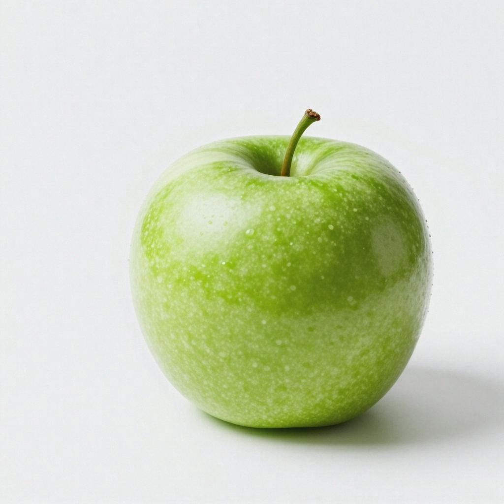 A ripe green apple on a seamless white background with soft 