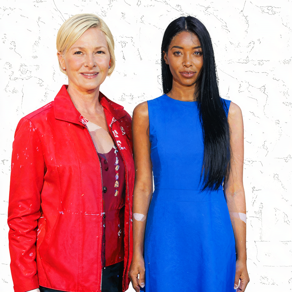 Two women standing side by side: one with short blonde hair 