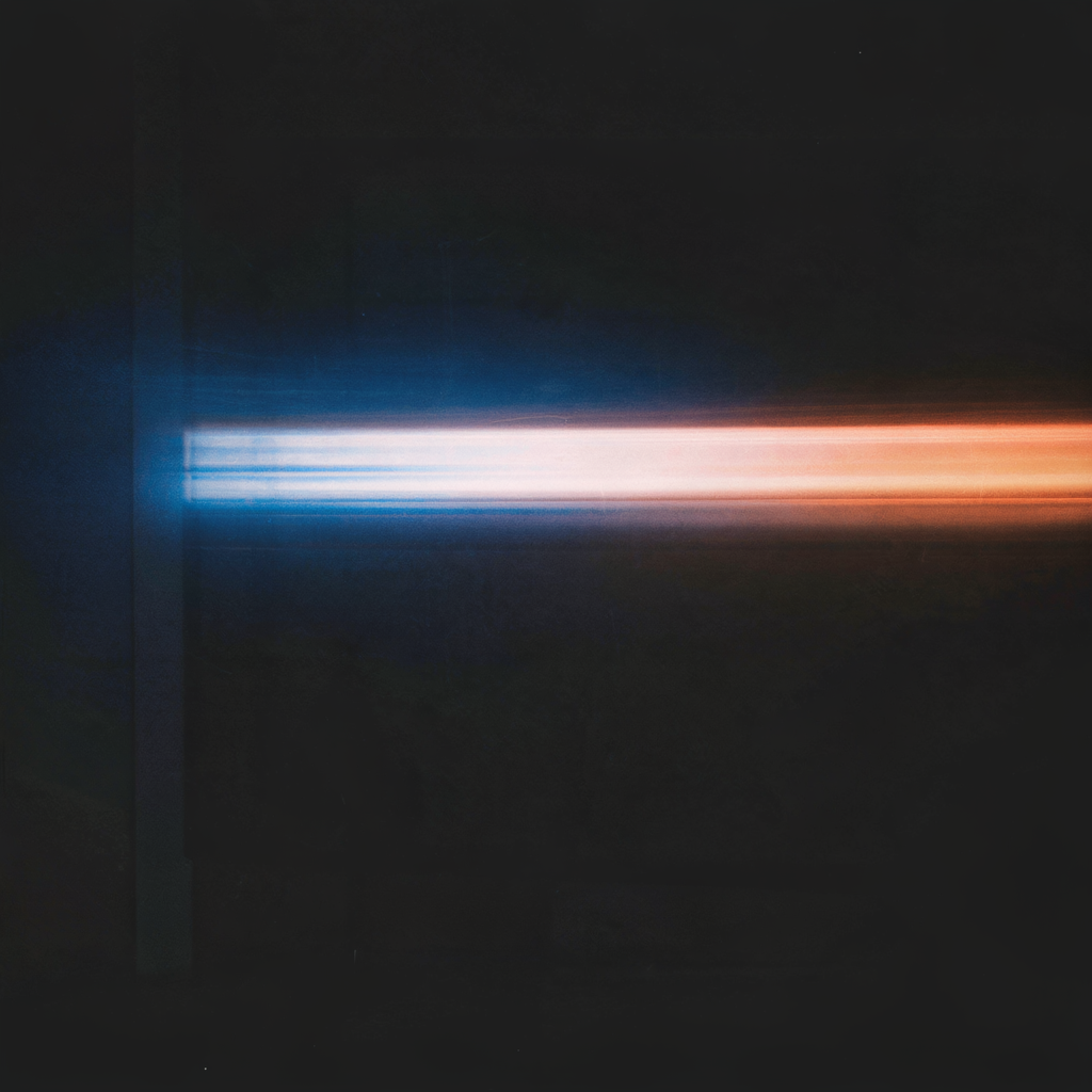 A cinematic frame with blue and orange anamorphic lens flare