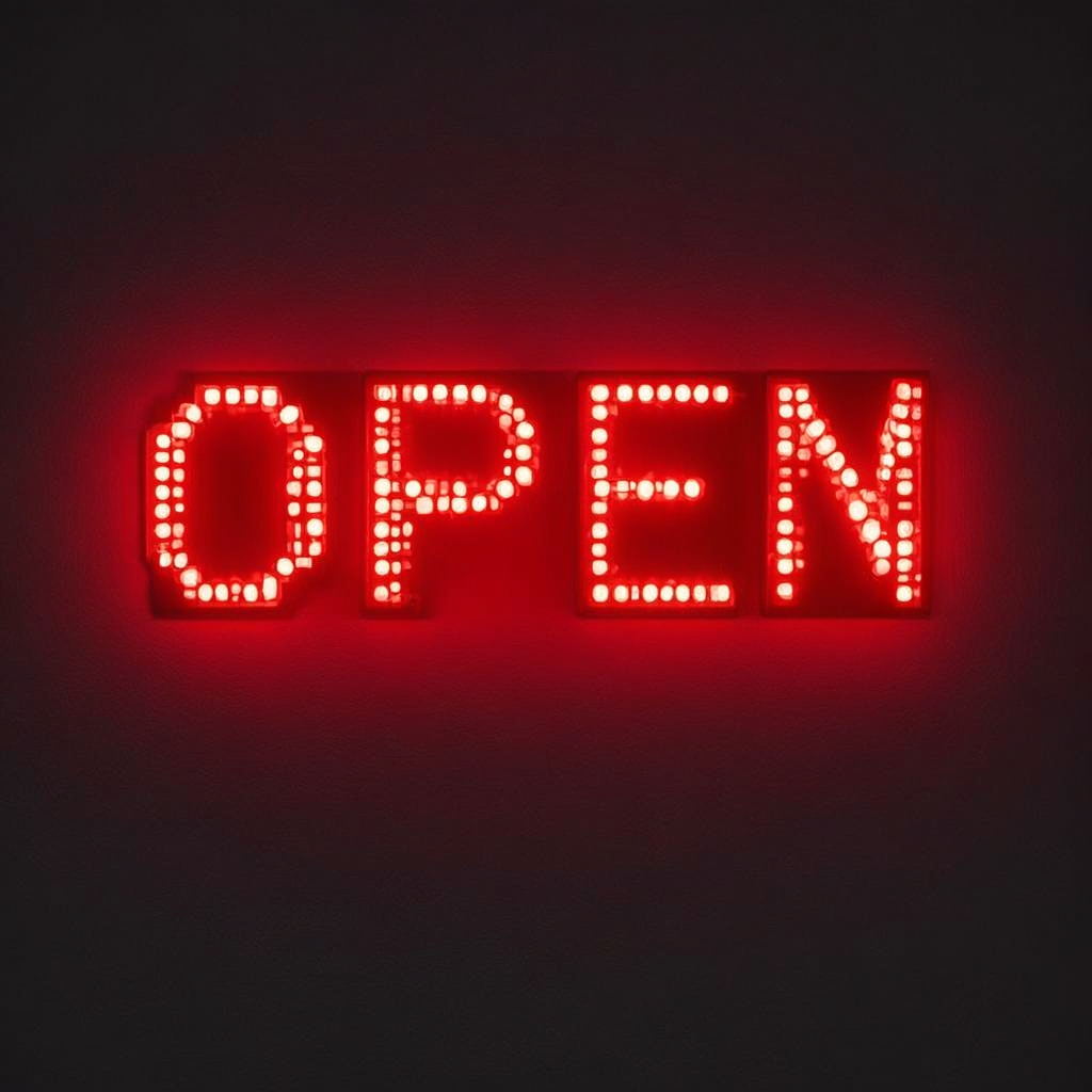 The word 'OPEN' displayed on a red LED sign with glowing pix