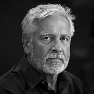 A portrait of a middle-aged man with a calm, serious express