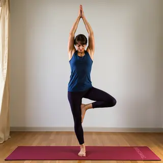 A person in a yoga tree pose — standing on one leg with the 