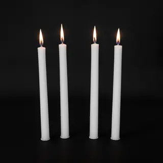 Exactly 4 white candles standing on a dark surface