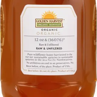 A product label for 'GOLDEN HARVEST ORGANIC HONEY' with subt