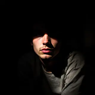 A portrait lit with classic Rembrandt lighting — triangle of