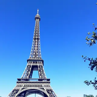 The Eiffel Tower in Paris on a clear day, architecturally ac
