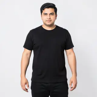 A person standing with both hands visible at their sides, fi