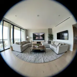 A wide-angle shot of a modern living room interior showing e