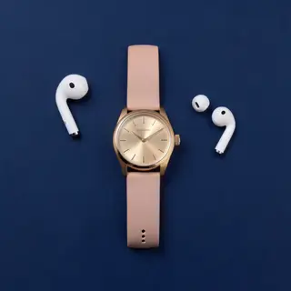 A product flat-lay on a #1A1A2E (deep dark blue) background,