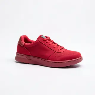 A single red sneaker on a clean white background with soft s