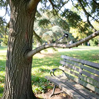 A bird perched on a branch, the branch extending from a tree