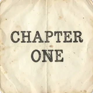 The word 'CHAPTER ONE' typed on aged paper with a vintage ty
