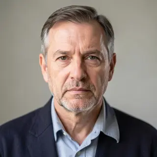 A portrait of a middle-aged man with a calm, serious express