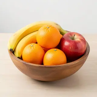 A fruit bowl containing exactly 3 bananas, 4 oranges, and 2 