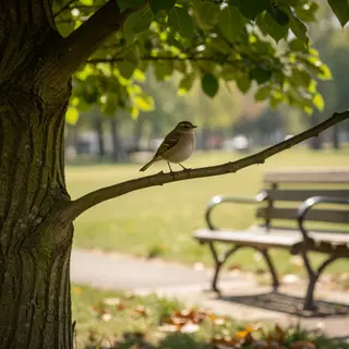 A bird perched on a branch, the branch extending from a tree