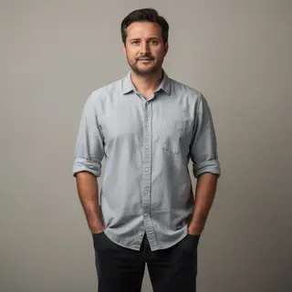 A man standing straight facing the camera, hands in pockets,