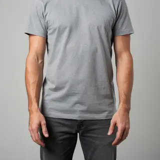 A person standing with both hands visible at their sides, fi