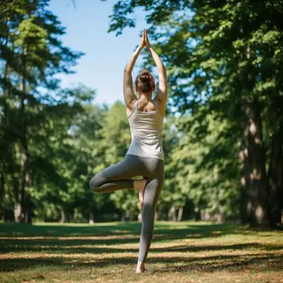 A person in a yoga tree pose — standing on one leg with the 