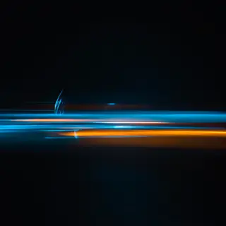 A cinematic frame with blue and orange anamorphic lens flare