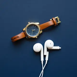 A product flat-lay on a #1A1A2E (deep dark blue) background,
