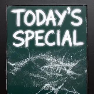 The phrase 'TODAY'S SPECIAL' written in white chalk on a dar