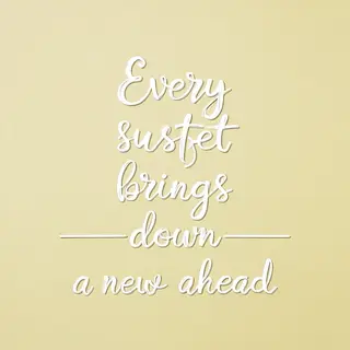 'Every sunset brings a new dawn ahead' written neatly on a p