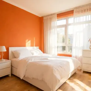 A bedroom wall painted in #FF6B35 (burnt orange) with white 