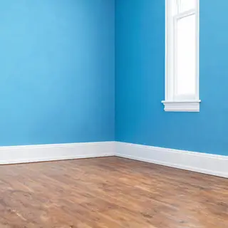 A room with walls in #4A90D9 (medium blue) with warm wooden 