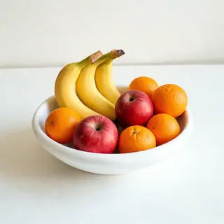 A fruit bowl containing exactly 3 bananas, 4 oranges, and 2 