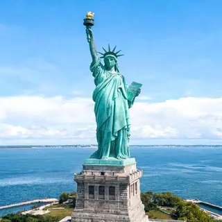The Statue of Liberty on her island pedestal, with correct t