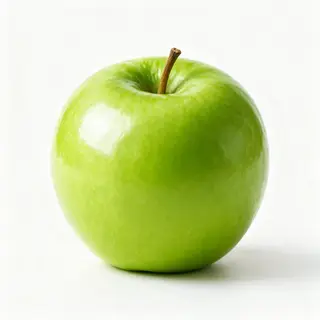 A ripe green apple on a seamless white background with soft 