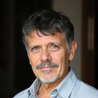 A portrait of a middle-aged man with a calm, serious express