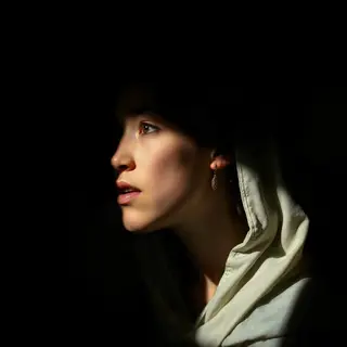 A portrait lit with classic Rembrandt lighting — triangle of