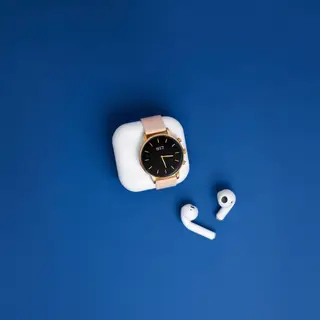 A product flat-lay on a #1A1A2E (deep dark blue) background,