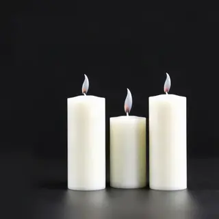 Exactly 4 white candles standing on a dark surface