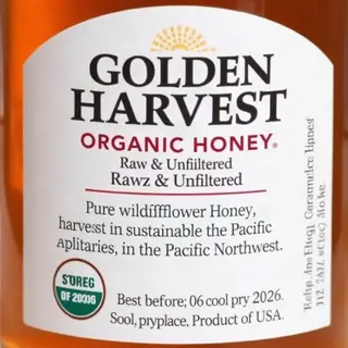 A product label for 'GOLDEN HARVEST ORGANIC HONEY' with subt