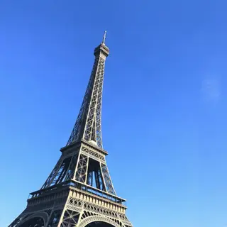 The Eiffel Tower in Paris on a clear day, architecturally ac