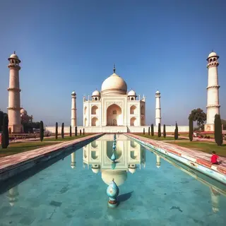 The Taj Mahal in Agra seen from the reflecting pool, with ac