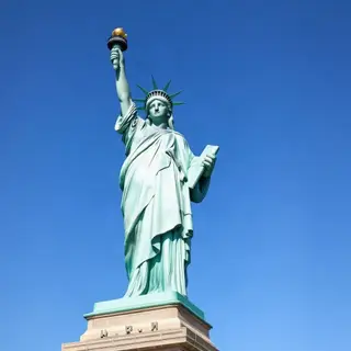 The Statue of Liberty on her island pedestal, with correct t