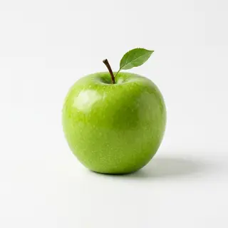 A ripe green apple on a seamless white background with soft 