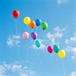 Exactly 11 colorful balloons floating against a clear blue s